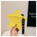 Detail of yellow star-shaped pouch with pebble grain texture and LOVE webbing strap - Yellow