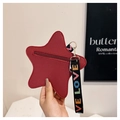 Detail of red star-shaped coin purse with litchi leather texture and LOVE strap - Burgundy