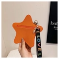 Macro detail of star-shaped orange coin purse with textured leather and LOVE strap - Orange
