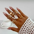 Detailed shot of layered gold rings featuring irregular textures and baroque pearls - Vintage Baroque Artificial Pearl Lava Style Ring (6282) / 12pcs Set / Light gold