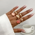 Close-up of five-piece gold alloy ring set with oval acrylic stones on model hand - Ring Set / Gold (6306)