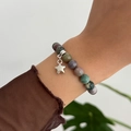 Macro shot of colorful natural stone bead bracelet with a silver star pendant on wrist - Star Pendant Multi-color Beaded Style (02916)