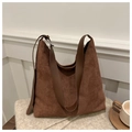 Brown vintage suede tote bag with large capacity for women on cozy knit background - Brown