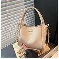 Chic beige lychee grain bucket bag with fine strap and 'Fashion' leather tag detail - White