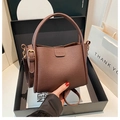 Dark brown lychee pattern bucket bag with fashion engraving and golden metal strap - Brown