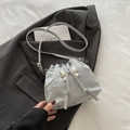 Light gray bucket bag with pleated glossy finish and silver metal bow ornament - Silver