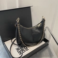 Chic black crescent PU leather underarm bag with gold chain and crossbody strap - Black