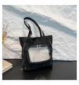 Detail of black wrinkled nylon tote bag featuring transparent PVC window and silver zippers - Black