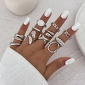 Detail view of liquid metal style silver rings with geometric and heart patterns - Light Gold 11-Piece Set (6338)
