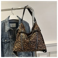 Detail of leopard print tote bag with silver zippers and black leather strap accents - Dark Brown