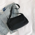 Black nylon bucket bag with GY logo embroidery and adjustable strap on denim jacket - Black