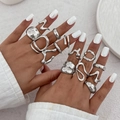 Macro detail of irregular silver lava liquid metal rings with polished mirror finish - 15 Piece Irregular Set (06339) / Gold