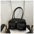 Detail of vintage black faux leather shoulder bag with two front pockets and gold buckles - Black