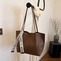 Dark brown matte leather tote bag with stylish branded ribbon on slim shoulder strap - Brown