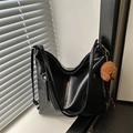 Classic black leather hobo bag with side zippers and a cute brown plush puppy charm - Black With Pendant