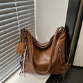 Brown faux leather tote bag with side zippers and decorative bear charm and tassels - Brown with Pendant