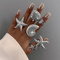 Ocean series ring set with starfish shells and pearls on bright silver bands - Light Gold Starfish Shell Style