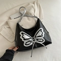 Sac à épaule noir en cuir avec emblème papillon argenté et bandoulière réglable - Noir