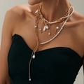 Elegant multi-layer baroque pearl necklace with golden chains on model's neck - Gold Multilayer Pearl Necklace (6657)