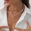 Close-up of bohemian layered beaded necklace with pink starfish pendant and pearls - Gold+Pink Sea Star Style (06419)