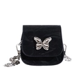Mini black velvet crossbody bag featuring a silver butterfly chain and metal clasp - Black