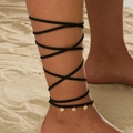 Bohemian black wrap-around thigh chain with golden sequins on a sandy beach background - Wrap-around Gold Disc Anklet (0421)