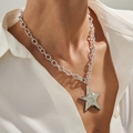 Silver chunky chain necklace with oversized star pendant worn on a white shirt - Silver Style(07381) / Silver