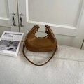 Chic brown patent leather crescent shoulder bag with metallic gold zipper and elegant finish - Brown