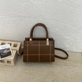 Vintage brown leather handbag with white contrast stitching and gold hardware accents - Brown