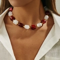 Detailed macro of vintage resin beaded necklace with burgundy and cream chunky stones - Red and Transparent (0077)