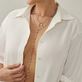Three-layer silver cross pendant necklace with pearls on a model wearing white shirt - Iron Chain / Imitation Pearl / Alloy / 3-Layer Cross Pearl Long Y-Necklace (06590) / Silver (06590)