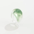 Close-up of translucent resin ring featuring unique light green cloud texture and dome shape - Transparent Green-0930