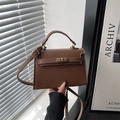 Vintage brown leather handbag with metal turn-lock closure and elegant top handle - Brown