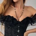 Detail of gothic black bead rosary necklace with engraved silver cross pendant on model - Rosary Long Style / Silver Black