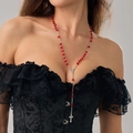 Gothic rosary necklace with red translucent beads and a silver cross pendant worn by model - Rosary Long Style / Silver Red