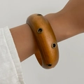 Retro wide wooden geometric bracelet with metal studs on minimalist brown wood texture - Light Brown (Wood with Metal Eyelets)