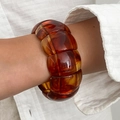 Amber resin chunky stretch bracelet with vintage geometric design on female wrist - Amber (Segmented Resin)