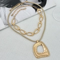 Layered gold cross pendant necklace with faux pearls and chunky chain shown on Vogue magazine - Double Layered Large Pendant Style (06326)