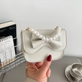 Cream white crossbody bag with pearl handle and bow accent on a mini square satchel - White