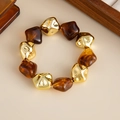 Detail of amber resin and gold metal beads on a vintage geometric stretch bracelet - Irregular Geometric Style (3008) / Gold + Coffee