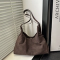 Dark brown suede hobo bag with a minimalist design and adjustable shoulder strap - Brown