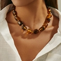 Ethnic style necklace with translucent amber resin beads and gold metallic spacers - Amber (0077)