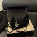 Minimalist black suede crescent underarm bag with silver beaded bow charm accessory - Black