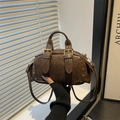 Retro dark brown leather bowling bag with gold hardware and a detachable shoulder strap - Brown