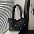 Quilted black tote bag with silver bow embroidery and metallic bow charm - Black