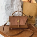 Brown frosted leather crossbody bag with gold round buckle and adjustable strap - Brown
