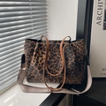 Large leopard print tote bag with brown handles and a geometric woven shoulder strap - Brown