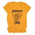 Close-up of Johnny Cash graphic print with cowboy boots and flowers on yellow cotton tee - S / Mustard Yellow (Black Text)