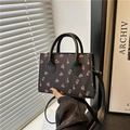 Mini black crossbody bag with red cherry print and leather top handle for women - Black