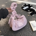 Pink corduroy baguette handbag featuring elegant ruched handles and white bow embroidery - Pink